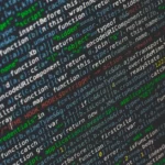 Close-up of colorful programming code displayed on a computer screen.