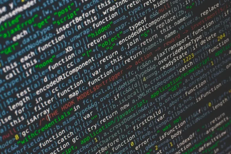 Close-up of colorful programming code displayed on a computer screen.